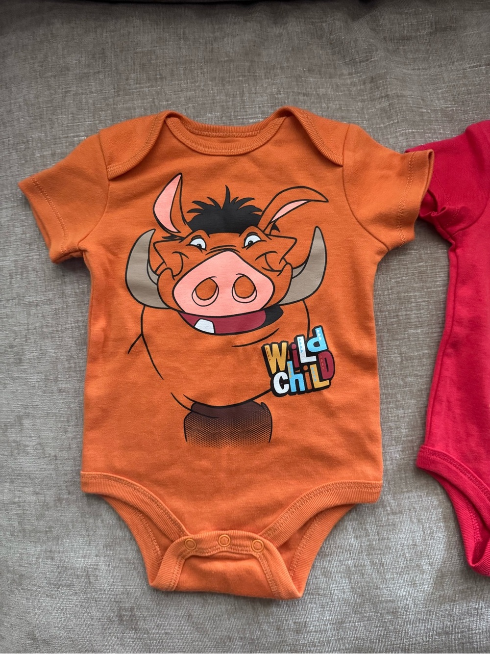 Disney Orange Pumbaa 'Wild Child' Graphic One-Piece Bodysuit
